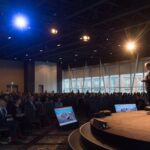 A photo of someone speaking during a conference inside the Halifax Convention Centre