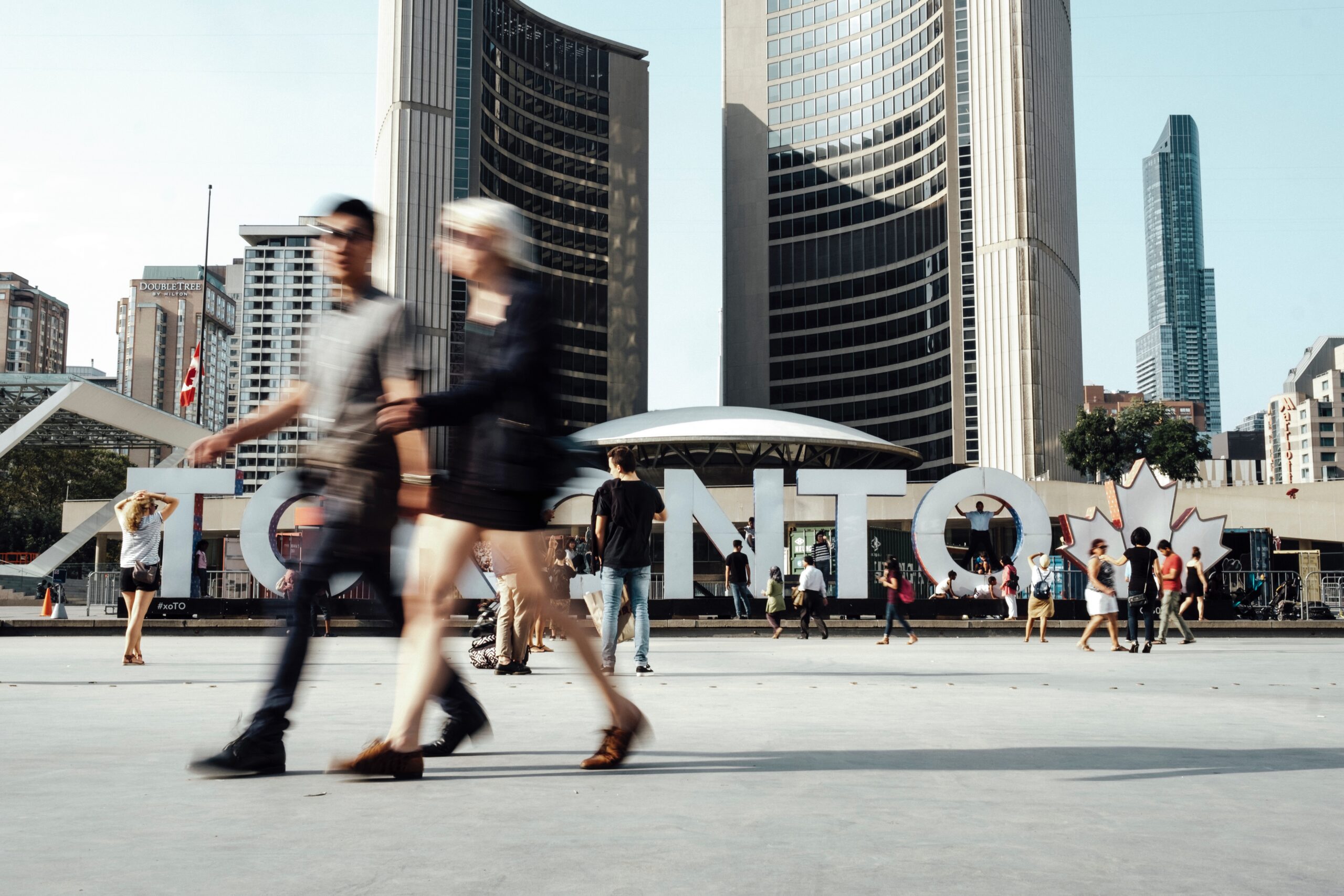 A photo of people in front of Toronto's city hall